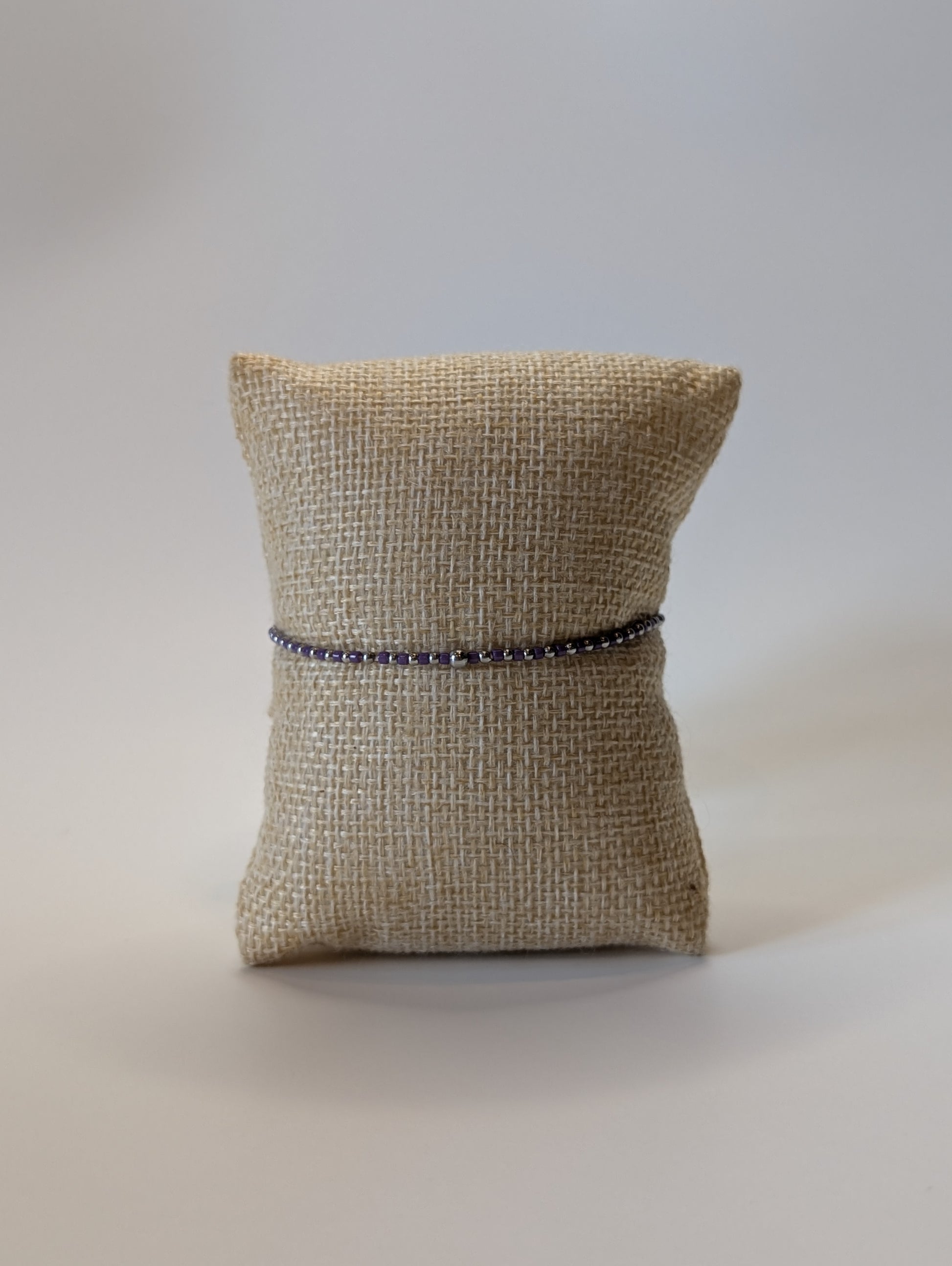 Stainless steel beaded bracelet with purple beads
