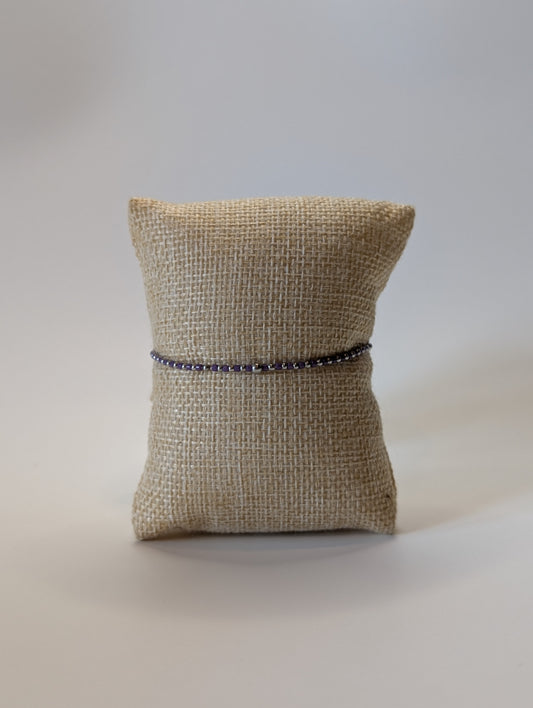 Stainless steel beaded bracelet with purple beads
